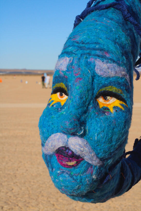 Yellow text on blue background, reading 'Coming Soon'